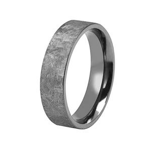 A silver metallic ring with a textured surface.
