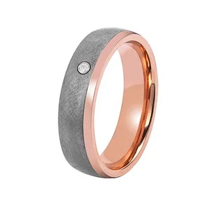 Two-toned ring with rose gold stripe and embedded diamond