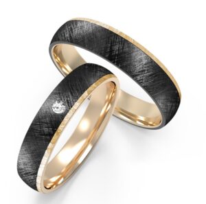 Yellow-gold accented textured black ring with embedded diamond
