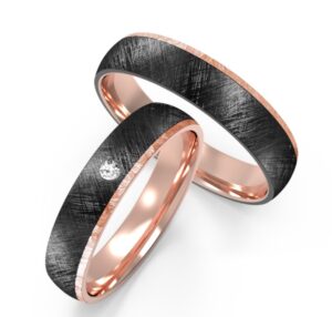 Rose-gold accented textured black ring with embedded diamond